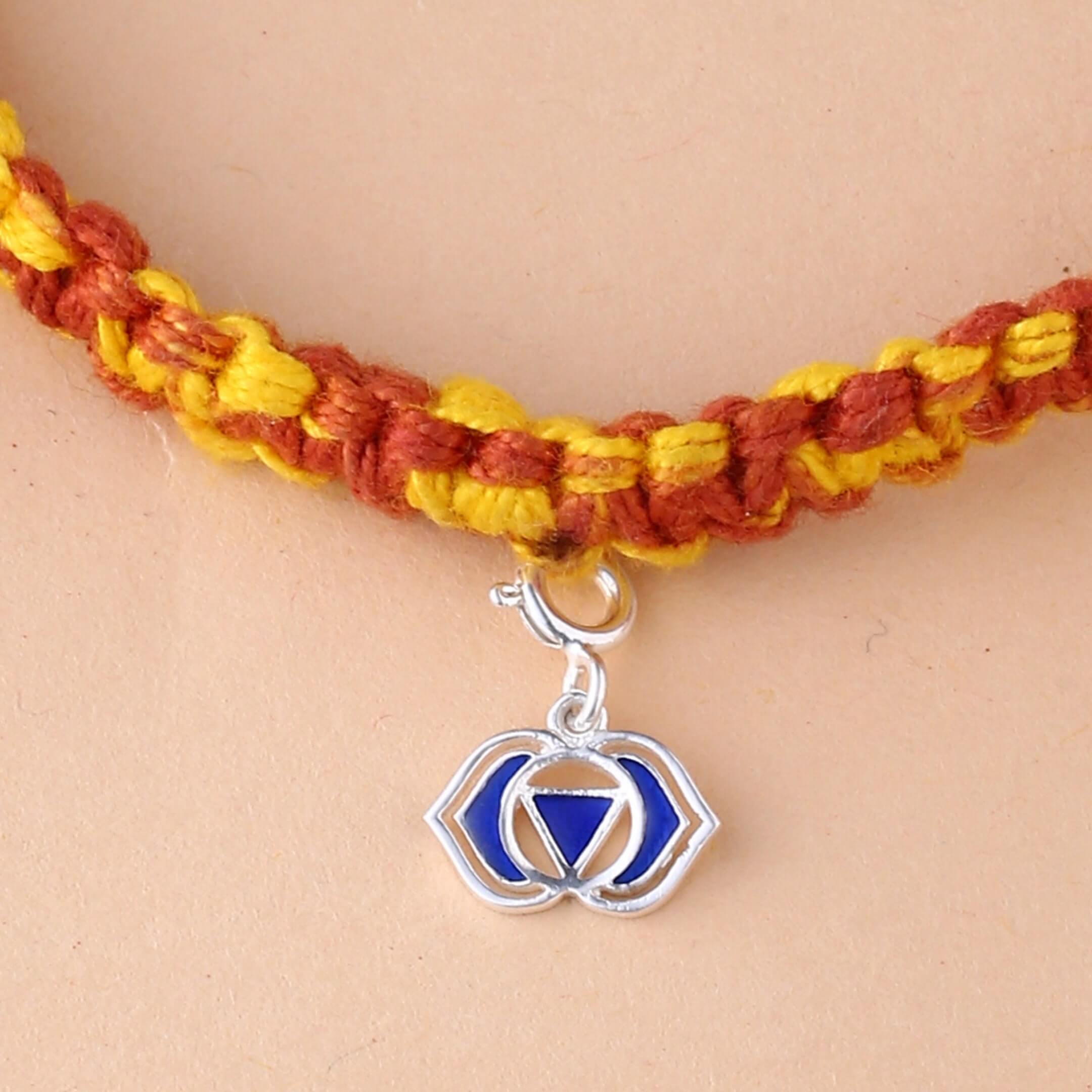 silver Ajna chakra rakhi with indigo colour meenakari work