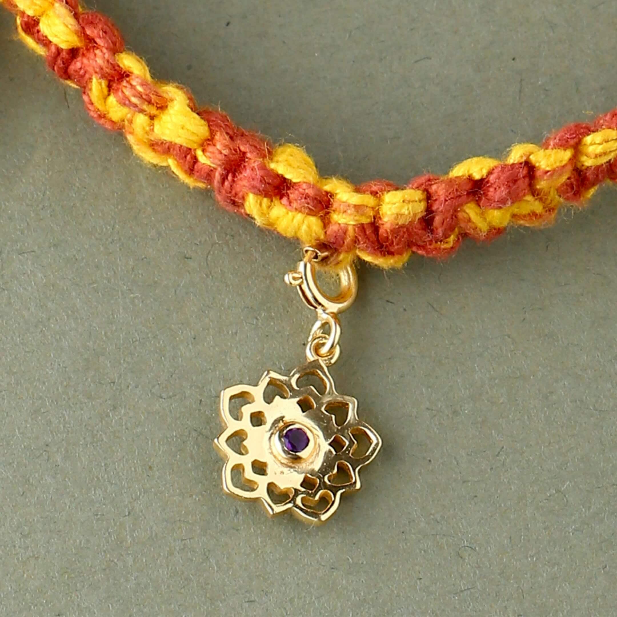 Sahasrara chakra gold rakhi in braided mauli