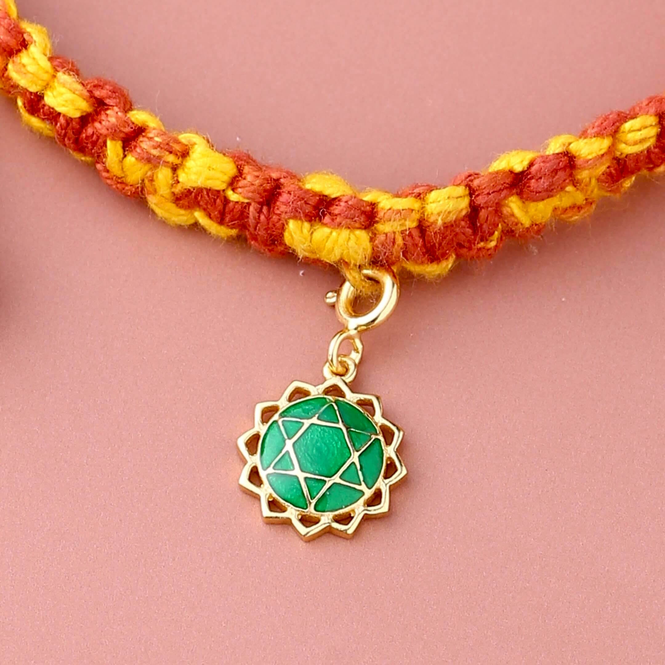 Anahata chakra gold rakhi in braided mauli