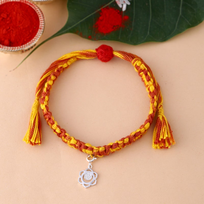 silver Swadhisthana chakra rakhi with textured finish