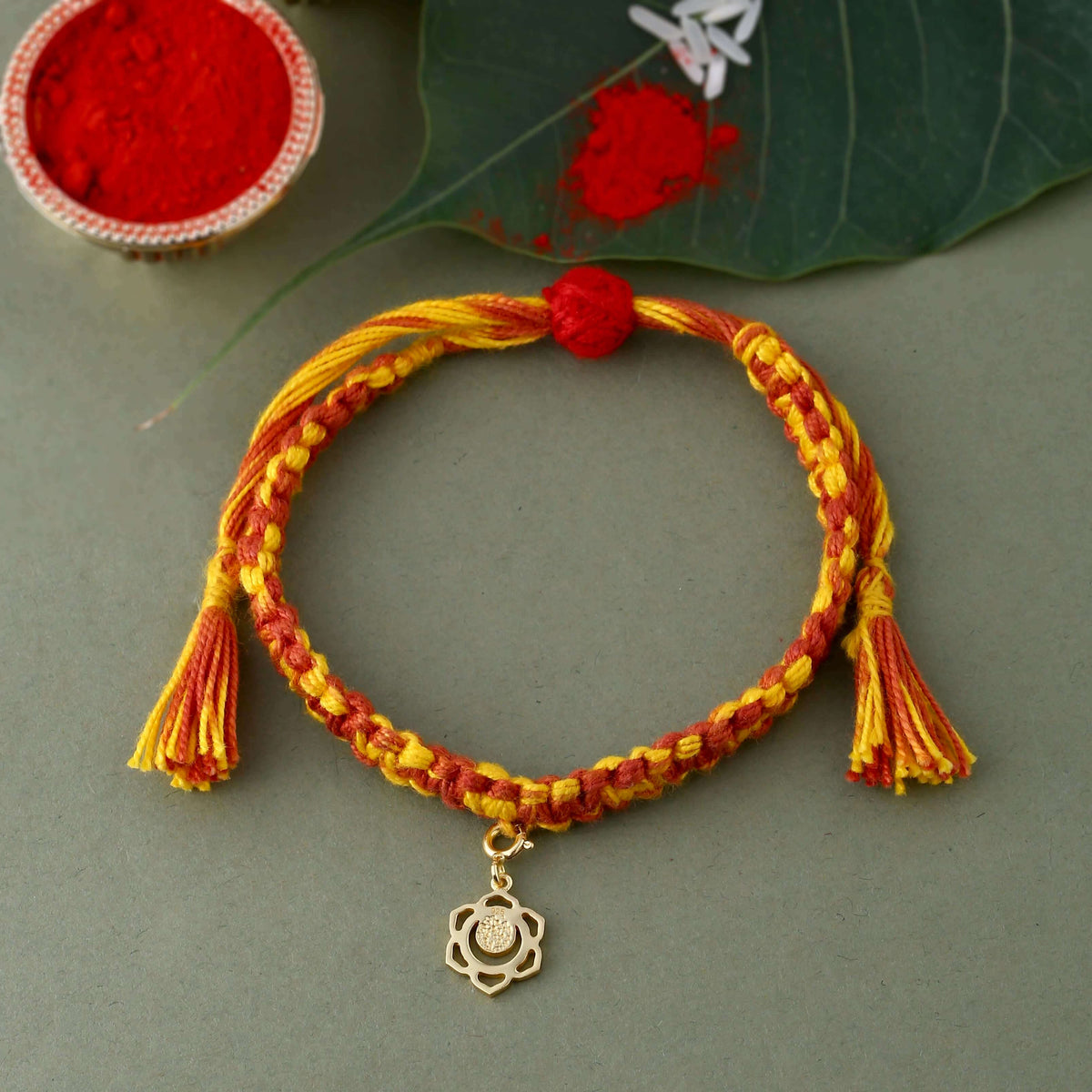 Swadhisthana chakra gold rakhi with textured finish