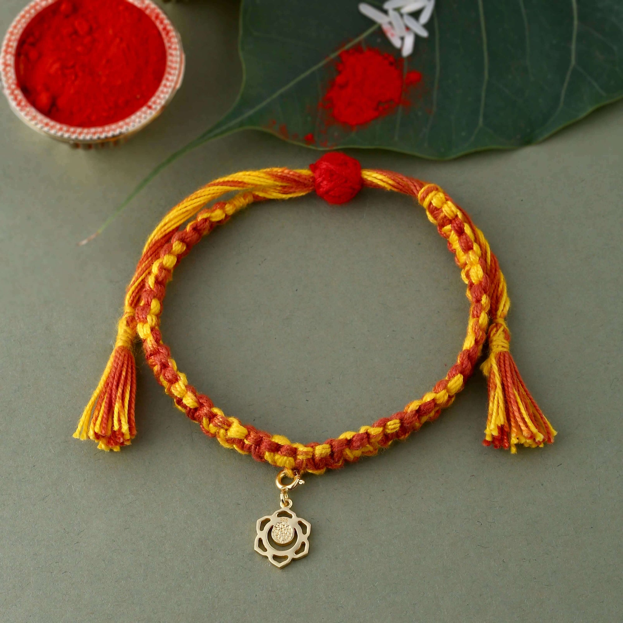 Swadhisthana chakra gold rakhi with textured finish