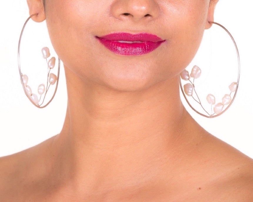 model with baroque bud ear hoops