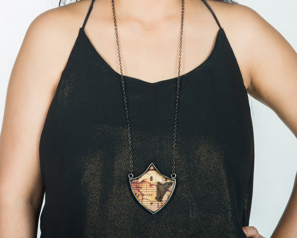 Harp musical shield neckpiece