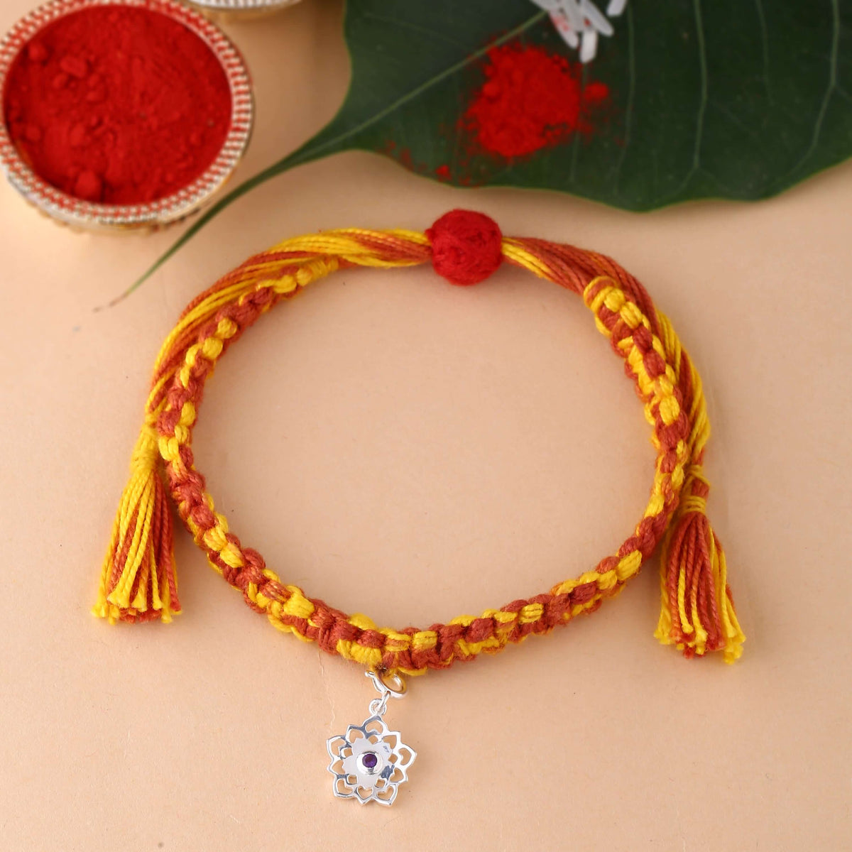 silver Sahasrara chakra rakhi with amethyst gemstone