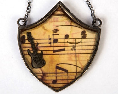 Copper with vintage finish musical guitar neckpiece