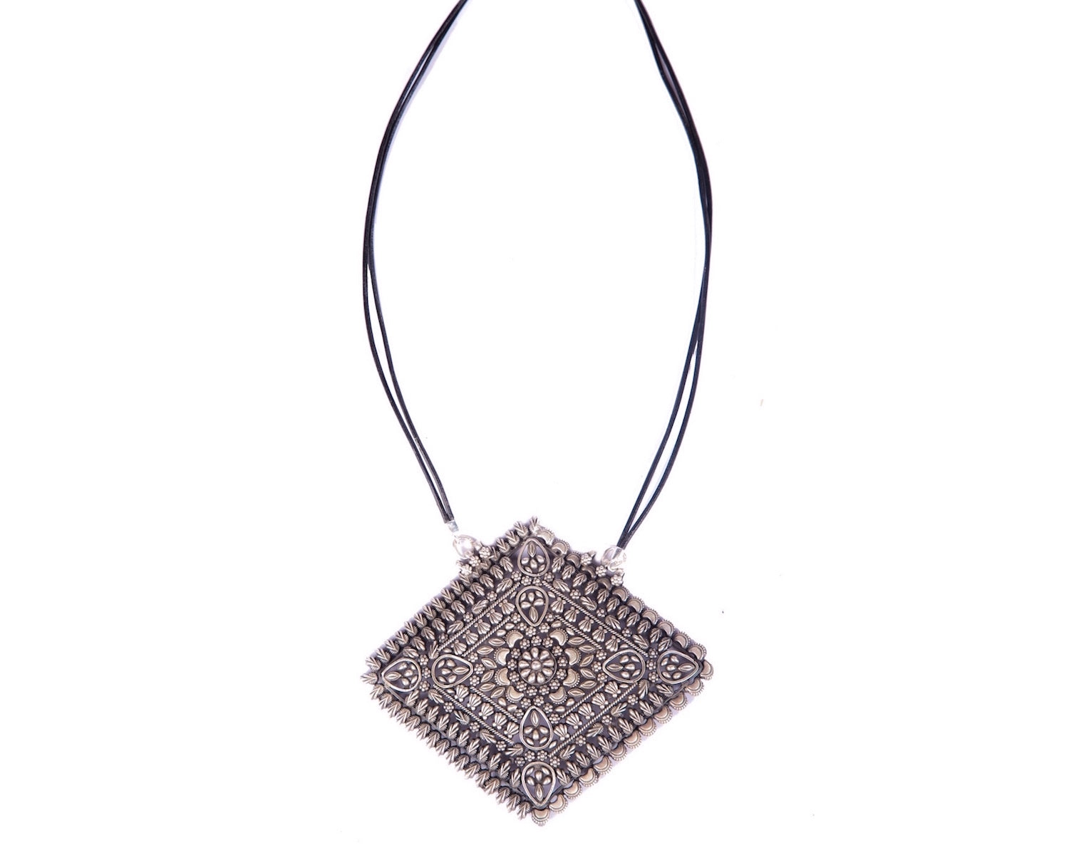 Rhombus shaped pendant strung in twin leather cords