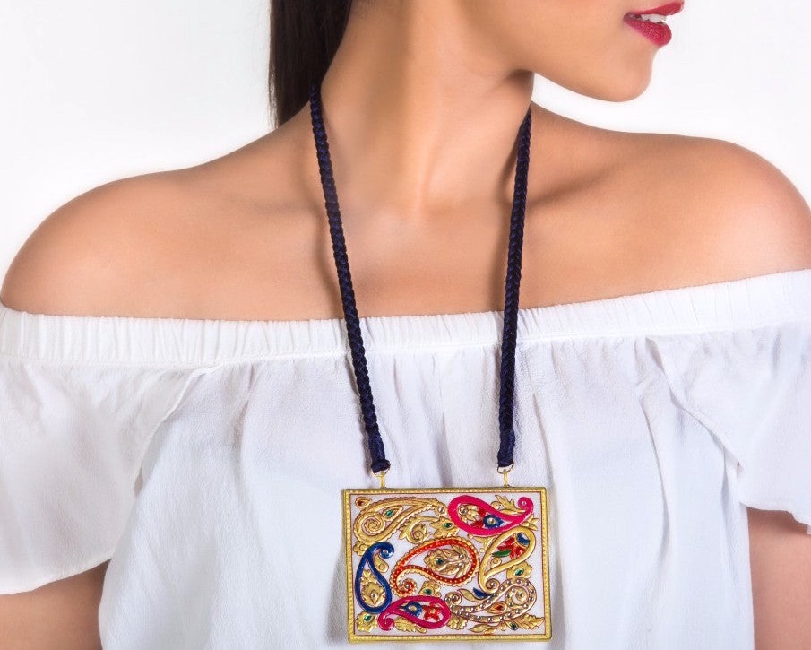 A model wearing Marble pendent with Kundan beads and Meenakari work