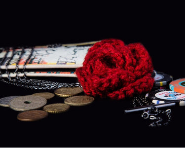 Red crochet flower with stylish metal chain neckpiece