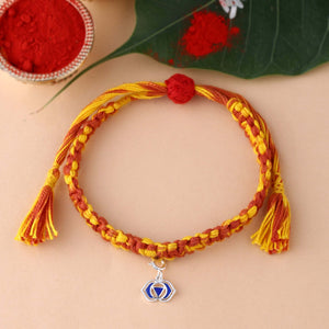 Silver rakhi with meenakari work in braided mauli bracelet