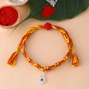 silver Muladhara chakra rakhi with Red Garnet gemstone